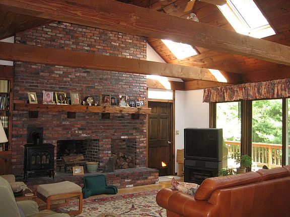 20x20 cathedral ceiling great room, with floor to ceiling fireplace