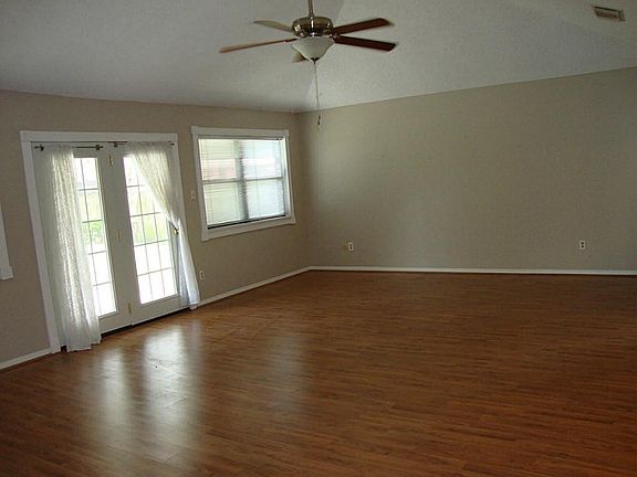 LARGE FAMILY ROOM THAT IS OPEN TO DINING AND KITCHEN.
