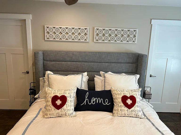 Enjoy the privacy of a detached cottage bedroom featuring its own ensuite bathroom and spacious walk-in closet. Perfect for a cozy, comfortable stay with all the comforts of home.
