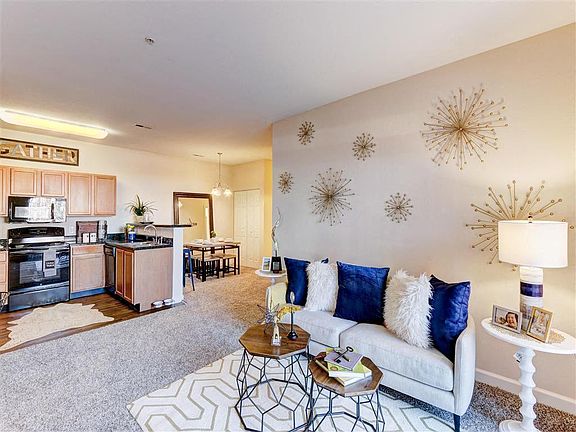 Residence at North Penn living room with hardwood kitchen flooring and lush carpet