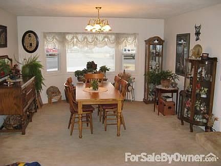 Large family room
						:
						Carpeted dining area and bay window; light for plants. French doors to kitchen.