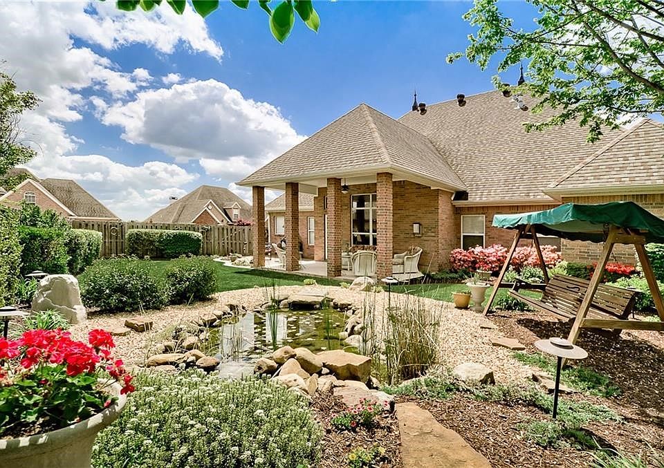 This incredible, low maintenance backyard is a TREASURE - and will embrace you and bring you back to center with its beauty and tranquil surroundings...