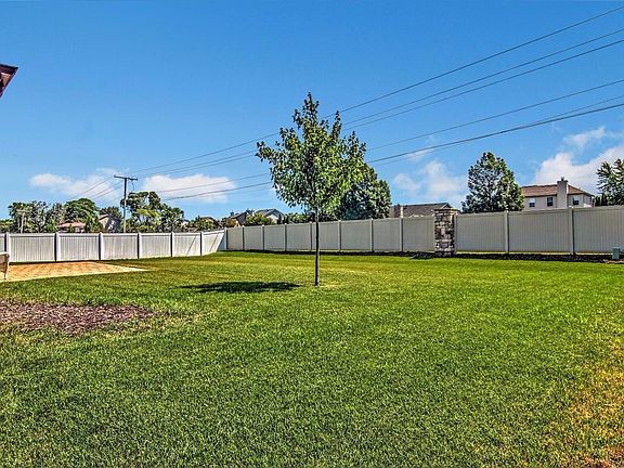SPACIOUS YARD OFFERS FENCING IN THE REAR AND SIDE FOR PRIVACY