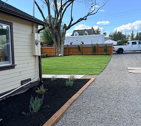 Driveway and plant bed.