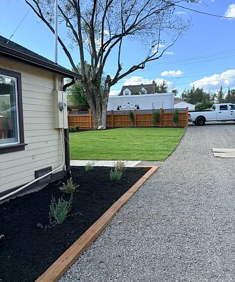 Driveway and plant bed.