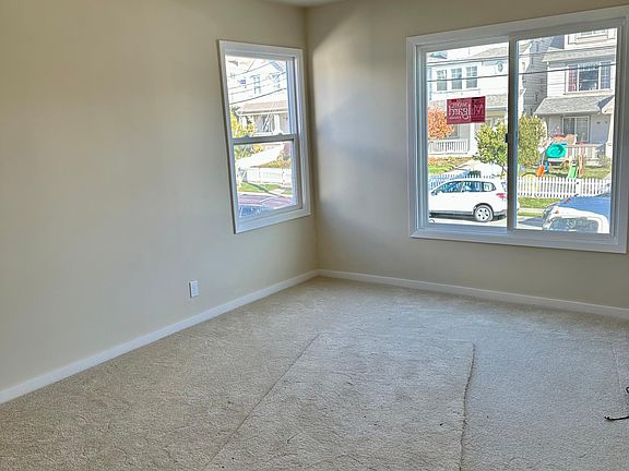 Bedroom with new windows, new carpets and new paint.