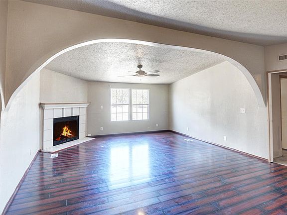 LIVING ROOM WITH WOOD-BURNING FIREPLACE