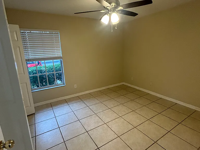 Picture of the second bedroom and newer ceiling fan