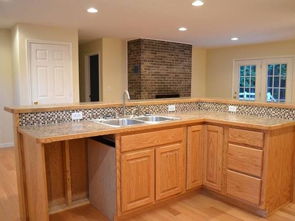 Whether it is parties or family gatherings, this kitchen is a dream for entertaining guests. You will love the open flow of the kitchen area to the living and dining areas. This large, custom island provides ample space to prepare a meal while conversing with friends/family sitting at the bar.