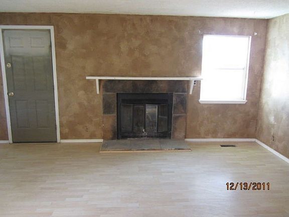 "Living room with a fireplace for those cold winter days!"