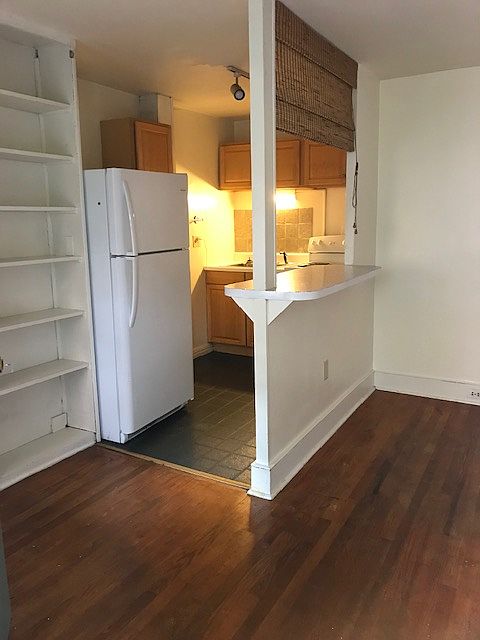 Galley kitchen with eat thru bar