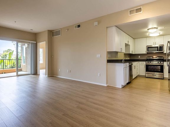 Living Room with Balcony and Hard Surface Flooring