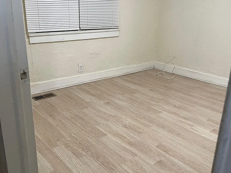 1st bedroom near the entrance with windows to street