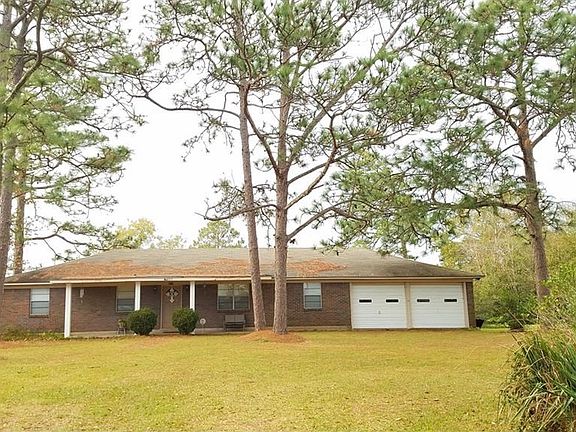 One owner brick home with double garage, 3 bedrooms, 2 baths, large formal and separate spacious family areas.