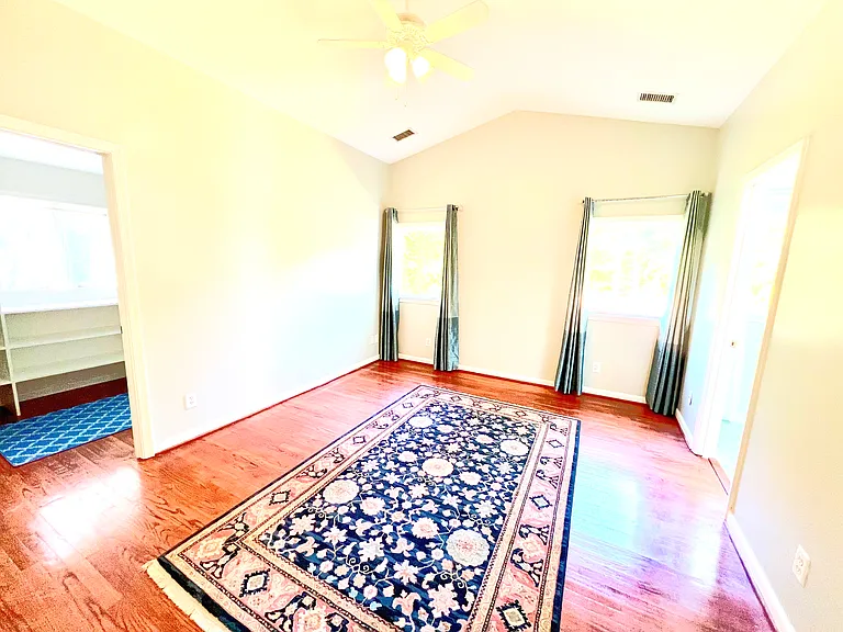Primary Bedroom, with walk in closet on the left, and entrance to the "master bath" to the right.