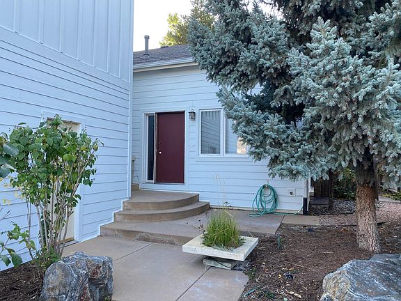 Front Entry. Door is being repainted a dark pewter gray.