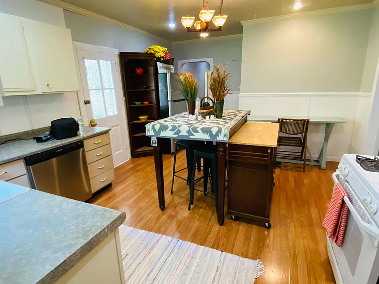 The large kitchen view from the back and mudroom's door.