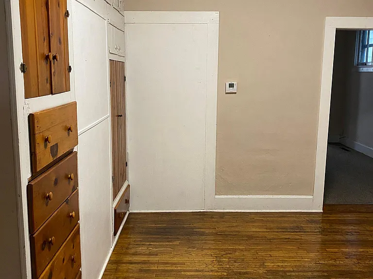 Dining room. Look at all those built in drawers and closets. What would you store there?