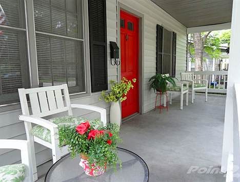  ON THE EXPANSIVE COVERED PORCH. 