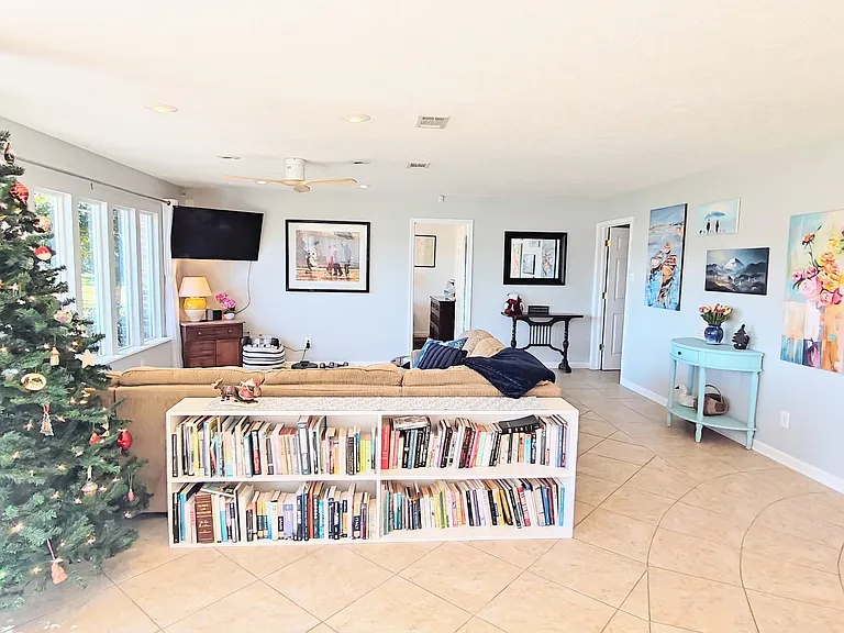 Living area looking west from dining table. Font bedroom beyond.