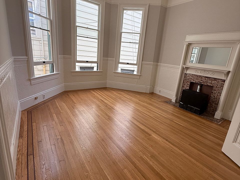 Bright and sunny living room with bay window