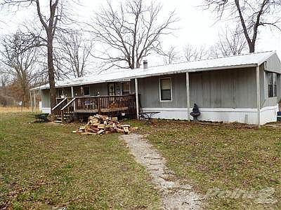 Welcome to this very private setting.  This 3bd/2bath mobile home sets off the main road in the woods.