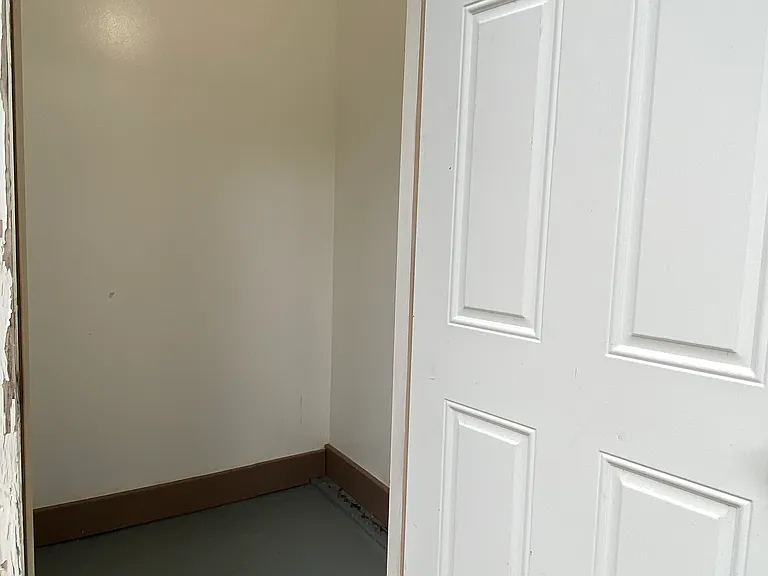 Deadbolt secured back patio insulated storage shed with light and outlets.