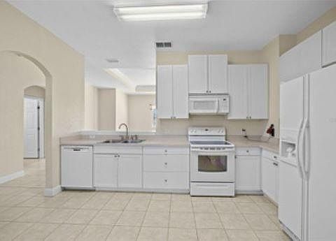 Kitchen - sink, microwave, range/oven and refrigerator.