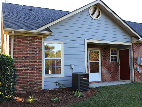 back view with covered patio