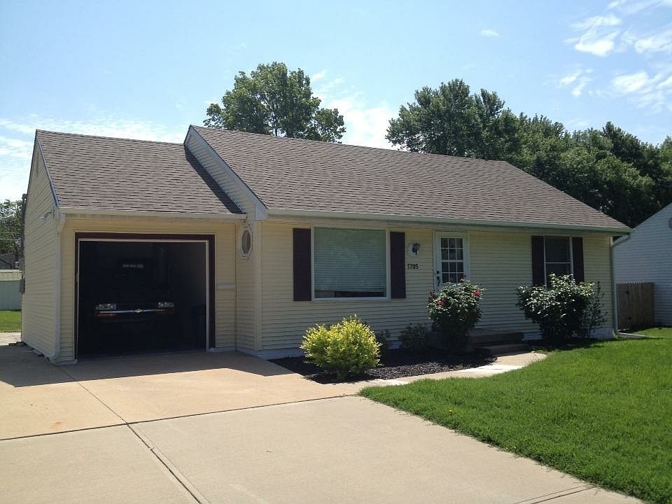 Front of House, one car garage, with room for 2-3 more cars