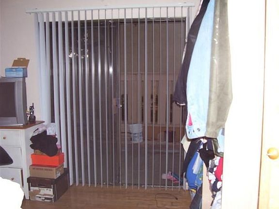 Living room with sliding glass doors that exit to patio