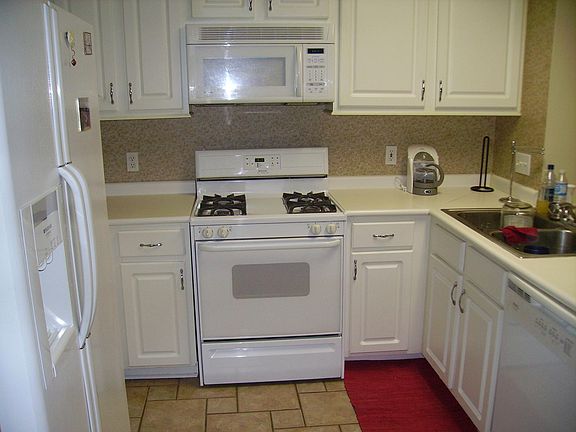 Kitchen. Updates include removal of wallpaper.