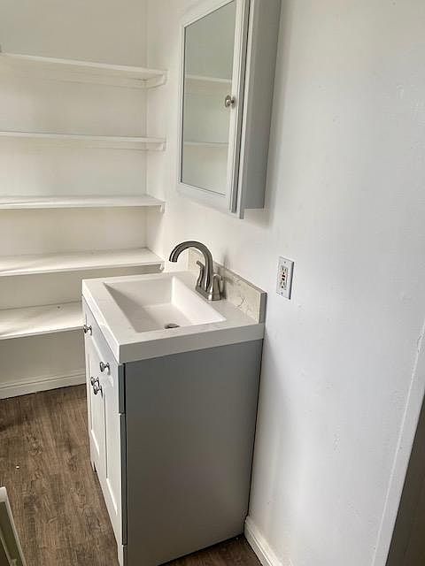 Updated bathroom with new vanity, sink, fixtures, toilet and updates flooring.