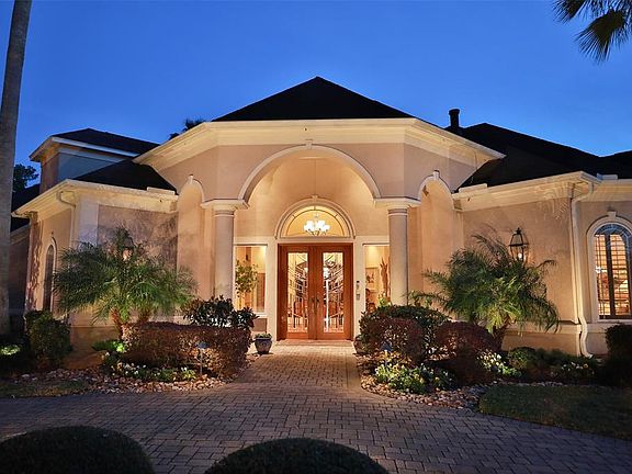 BRICK PAVER CIRCULAR DRIVEWAY LEADS TO THE MAGNIFICENT ENTRY