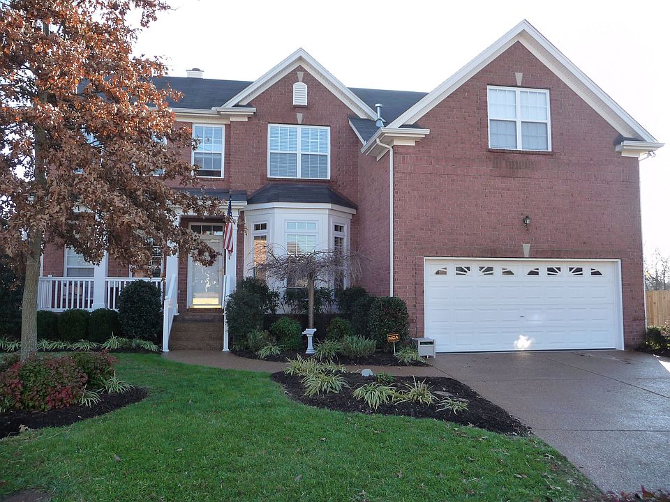 Front of House.  Two car garage is extra deep tandum with room for boat, etc.