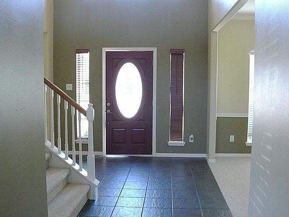 Impressive entry with tile floors, and leaded glass door