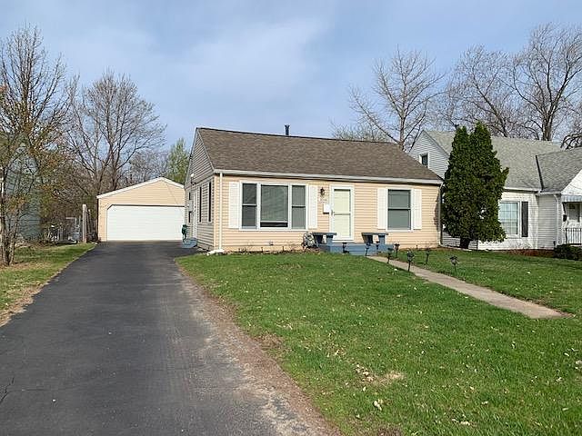 Front of home and 2 car garage with nice driveway from the main street