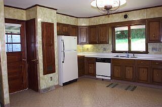 Kitchen - Sink to Refrigerator - Showing Side Door To Covered Patio