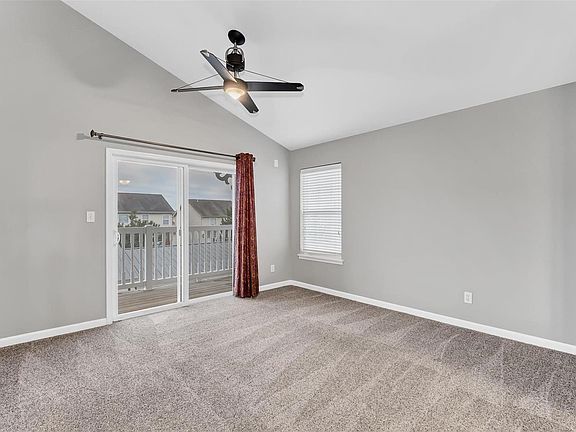 Vaulted Great Room that leads to covered deck