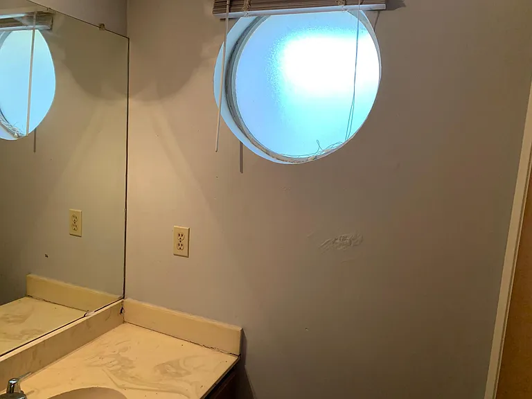 Moon window in upstairs second bathroom.