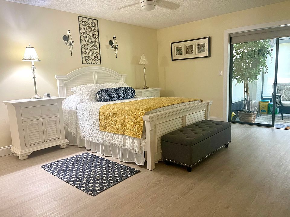 The master bedroom is large and has queen size plush bedding.