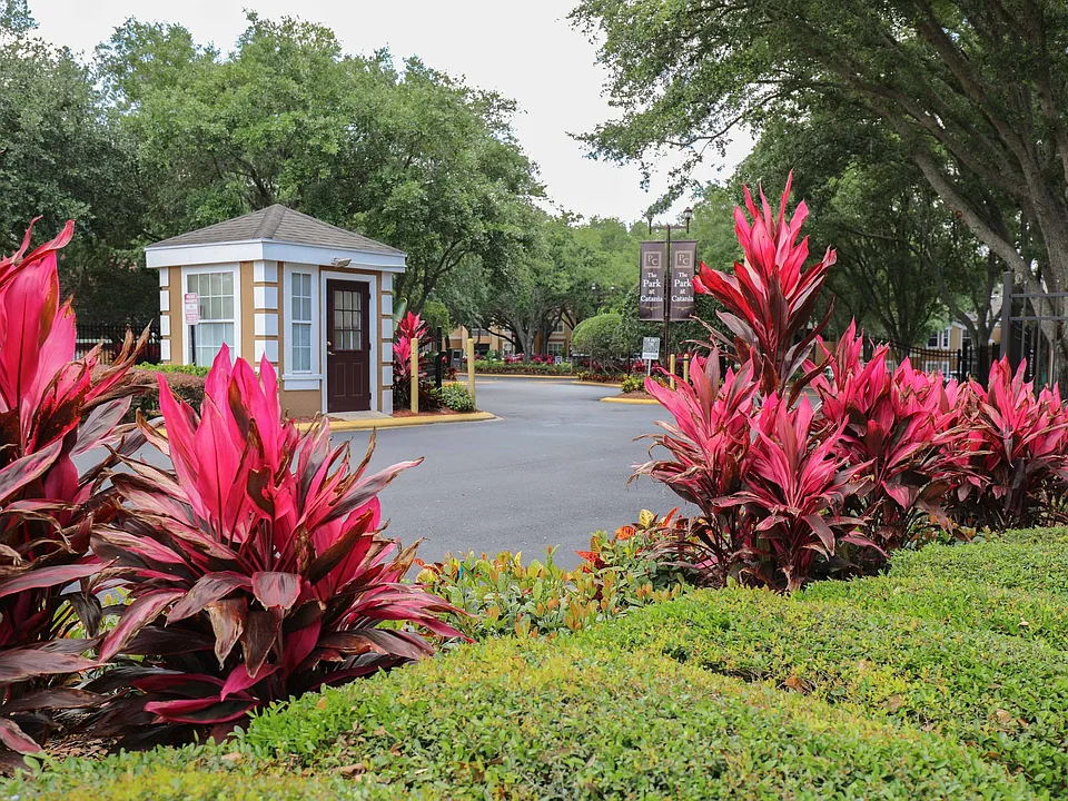Welcoming community entrance with beautifully maintained landscaping
