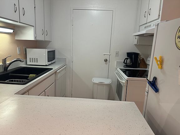 Looking into kitchen from dining space