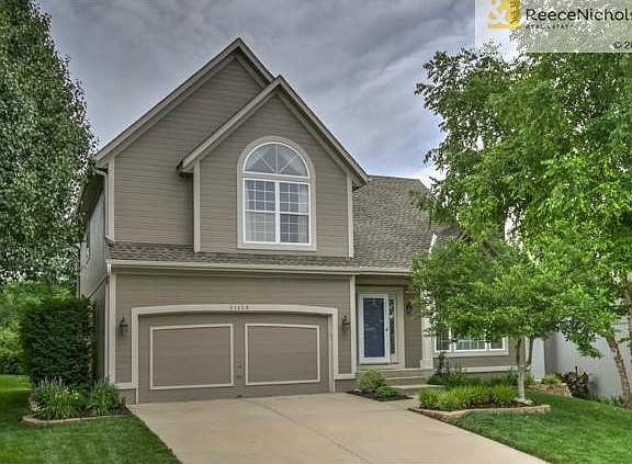 Professionally landscaped exterior and lush grass.