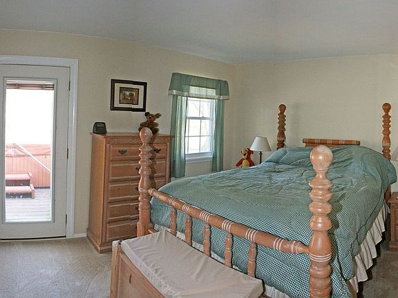 Owner Bedroom with Bath Ensuite and Door to Hot Tub on Deck