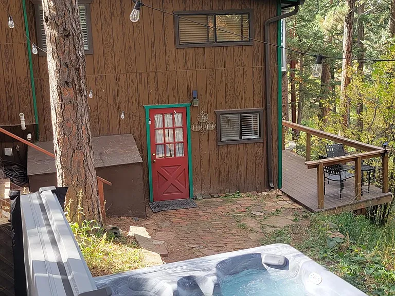Hottub is a 10-step easy walk from the downstairs/ kitchen door, shared with main house.