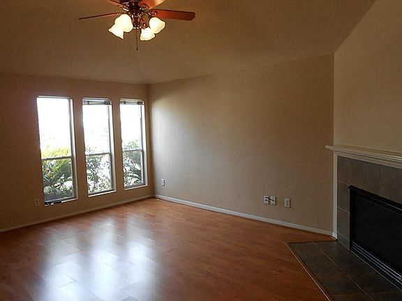 Formal Living Room With Wall Of Windows. Fireplace To Separate Formal Dining Room.