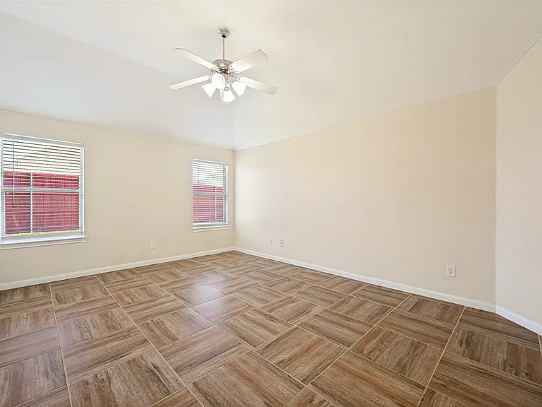 Spacious room with ceiling fan