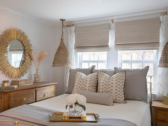 Bedroom has blackout roller shades and a good size closet (double row hanging)