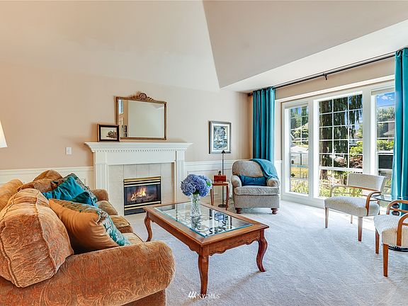 Formal living room with gas fireplace.>